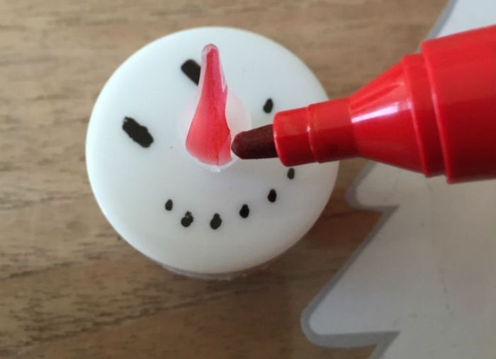 sneeuwpop van waxinelichtje